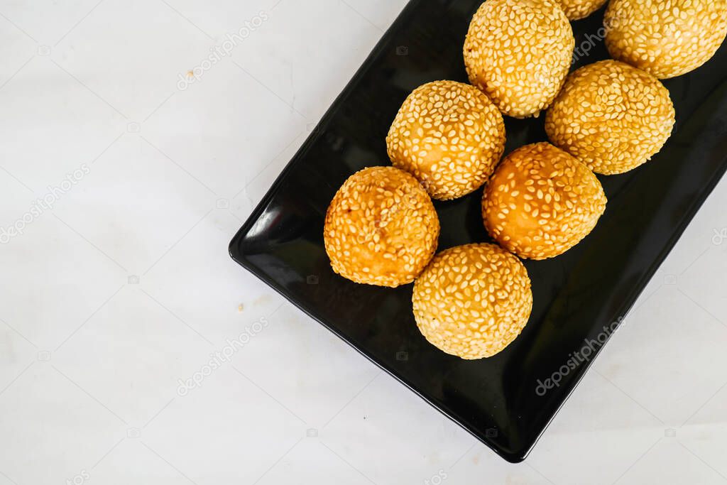 onde-onde or sesame ball or Jian Dui is fried Chinese pastry made from glutinous rice flour and coated with sesame seeds filled with bean paste. isolated on white background