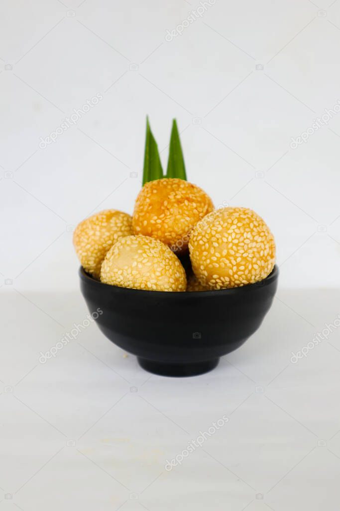 onde-onde or sesame ball or Jian Dui is fried Chinese pastry made from glutinous rice flour and coated with sesame seeds filled with bean paste. isolated on white background