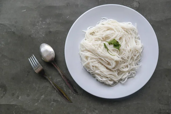 bihun or vermicelli or rice noodles or angel hair served on plate isolated on black background