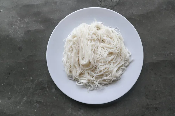 bihun or vermicelli or rice noodles or angel hair served on plate isolated on black background