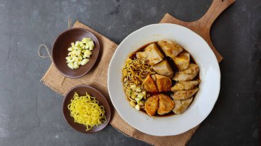 Pempek or empek-empek or fish cake is a food made from soft ground fish meat mixed with tapioca flour or sago flour, eggs, mashed garlic, flavoring, and salt