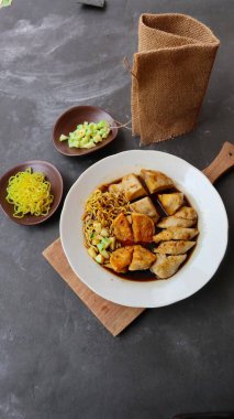 Pempek or empek-empek or fish cake is a food made from soft ground fish meat mixed with tapioca flour or sago flour, eggs, mashed garlic, flavoring, and salt