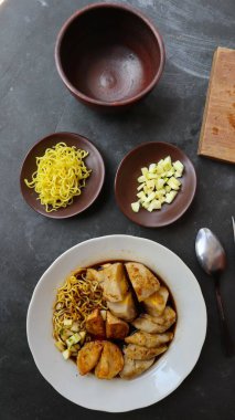 Pempek or empek-empek or fish cake is a food made from soft ground fish meat mixed with tapioca flour or sago flour, eggs, mashed garlic, flavoring, and salt