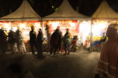 klaten, Indonesia - July 4, 2021. street food stalls selling various kinds of street food, at night market events in Indonesia. in the photo with the slow motion technique