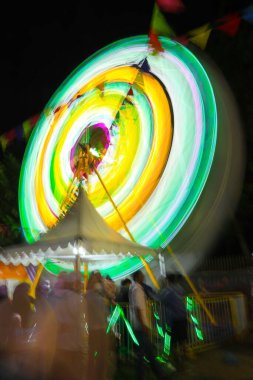 Ferris wheel at night festival in slow motion photo. High Roller