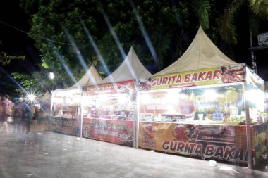 klaten, Indonesia - July 4, 2021. street food stalls selling various kinds of street food, at night market events in Indonesia. in the photo with the slow motion technique