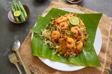 Pad thai, or Phad thai, is a stir-fried rice noodle dish from Thailand. made from rice noodles, , bean sprouts, eggs, prawns and Thai spices clipart