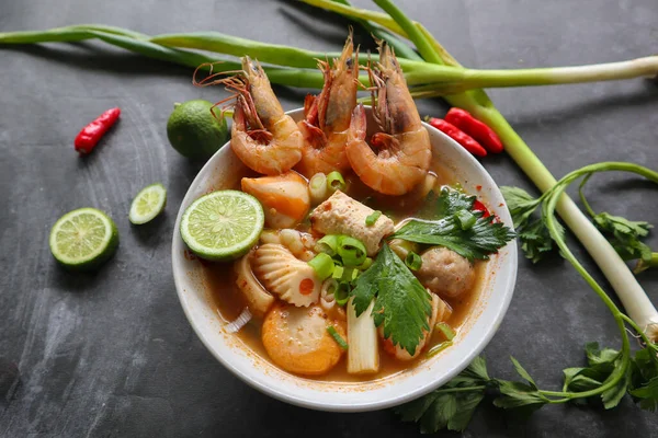 Tom yam soup originating from Thailand. Tom yum is made with shrimp, chili, lime, chicken, fish, or seafood and mushrooms.