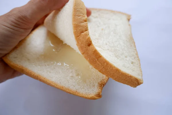 Bread Condensed Milk Hand White Paper — Stock Photo, Image