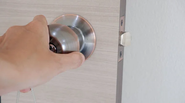 Handle door knob and close or open the door and copy space