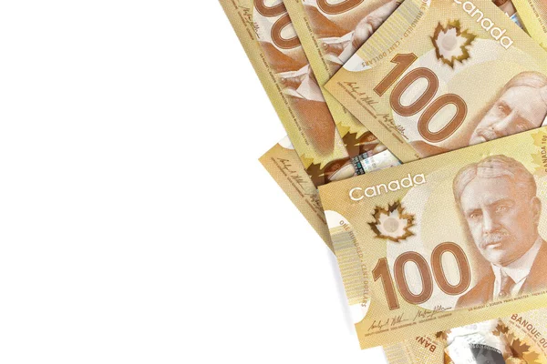 Direct boven Afbeelding van Crisp Canadian 100 honderd dollar facturen op een witte achtergrond — Stockfoto
