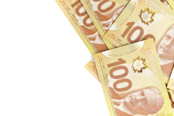 Direct boven Afbeelding van Crisp Canadian 100 honderd dollar facturen op een witte achtergrond — Stockfoto