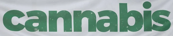Bandeira branca com a palavra Cannabis em letras verdes — Fotografia de Stock
