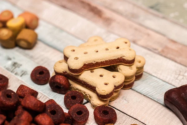 Pet Food Snacks Dogs Dog Tasty Colored Biscuits Wooden Background — kuvapankkivalokuva