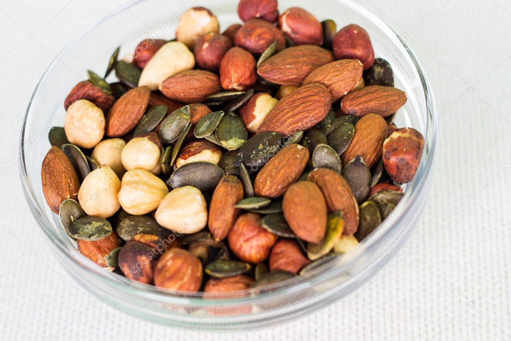 Bowl full of walnuts, hazelnuts, brazil nuts, and almonds