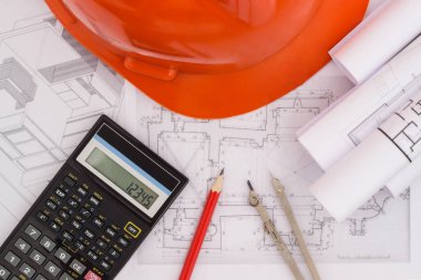 Planları ve ahşap arka plan üzerinde inşaat araçları