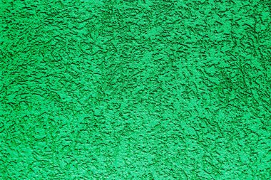Yeşil boyalı sıva duvar. Yeşil beton duvar bariyeri yeni alçı granit desen, arka plan