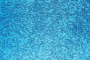 Mavi boyalı sıva duvar. Mavi beton duvar bariyeri Yeni alçı granit desen, arkaplan