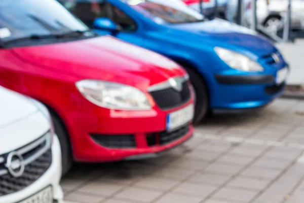 Car parking in line outdoor. Cars in the parking lot in row