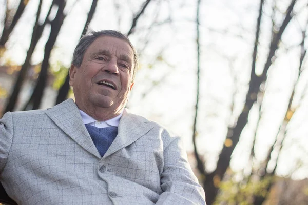 Portrait of happy and laughing senior man. Elder health and retirement concept