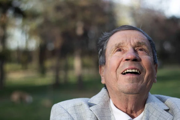 Portrait of happy and laughing senior man. Elder health and retirement concept