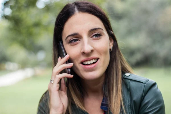 Young Woman Talking Mobile Phone Looking Away Fall Season —  Fotos de Stock