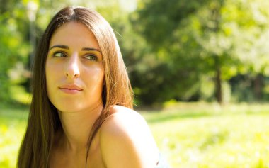 Portrait of Happy cheerful beautiful woman in the park
