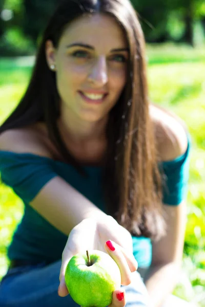 Young Woman Smiling Holding Apple Outdoors Sunny Day — Foto Stock