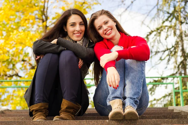 Two Young Smiling Friends Sitting Stairs Autumn —  Fotos de Stock
