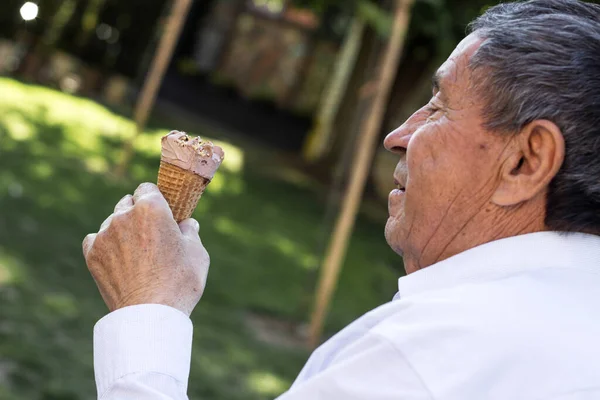 Happy senior Man eating ice cream