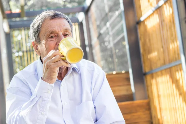 Smiling Senior Man Enjoying Morning Coffee —  Fotos de Stock