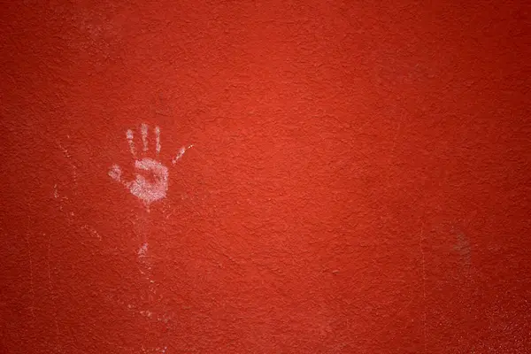 Rote Wand mit Handabdruck