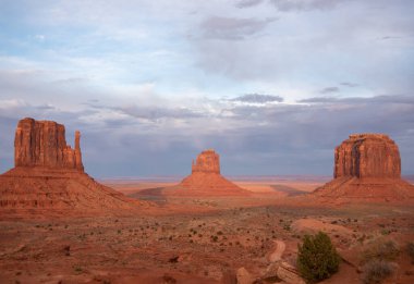 sunset in monument valley with storm rolling in 
