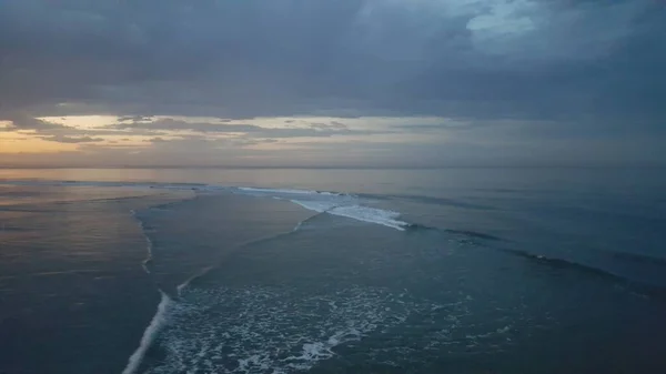 Beautiful Ocean sunrise - sunlight reflected off of calm and beautiful ocean waves