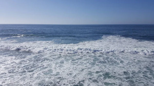 California, orange county - beautiful waves splashing against the sandy shore