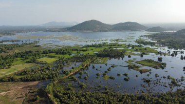 Beautiful view from the drone to the lake and mountains. Brateak Krola Lake. Cambodia