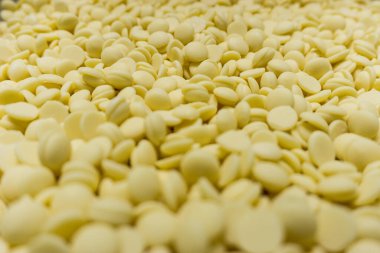 Field of many white chocolat pellets