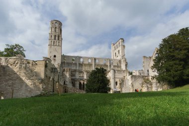 Ruin of the monastery with the Abbey Jumieges with green meadow in front, Normandy, France