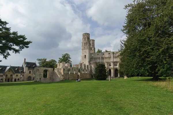 Ruin of the monastery with the Abbey Jumieges with green meadow in front, Normandy, France