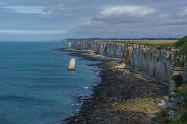 High angle view at teh coastline with chalk cliffs and rock formations on a summer day at Etretat, Normandy, France