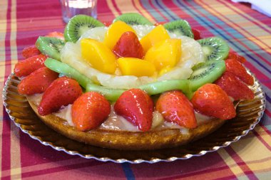 Kiwi, peach, pineapple, strawberry and apple fruit tart