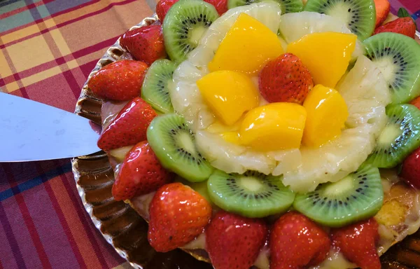 Kiwi, peach, pineapple, strawberry and apple fruit tart