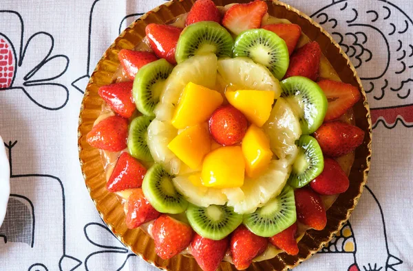 Kiwi, peach, pineapple, strawberry and apple fruit tart