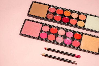 Makeup, lipstick and brushes ready to use