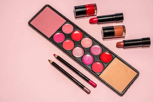 Makeup, lipstick and brushes ready to use