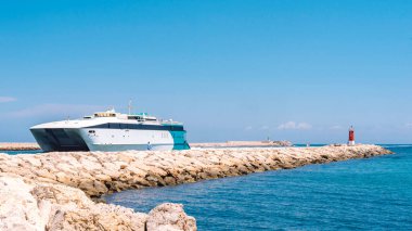 Sailboat at the exit of the port snack