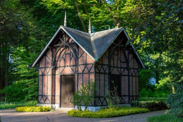 Typical Germany house in a park surrounded by green trees
