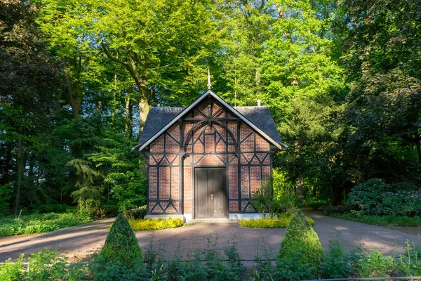 Typical Germany house in a park surrounded by green trees