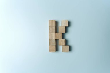 Letter K from wooden dice White Background