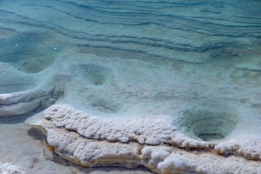 Dead sea of Jordan, it is famous for its saturated salty waters; the water is so salty that no marine life can survive in this sea, and so dense that you can swim on the surface of the water and not dive deep.